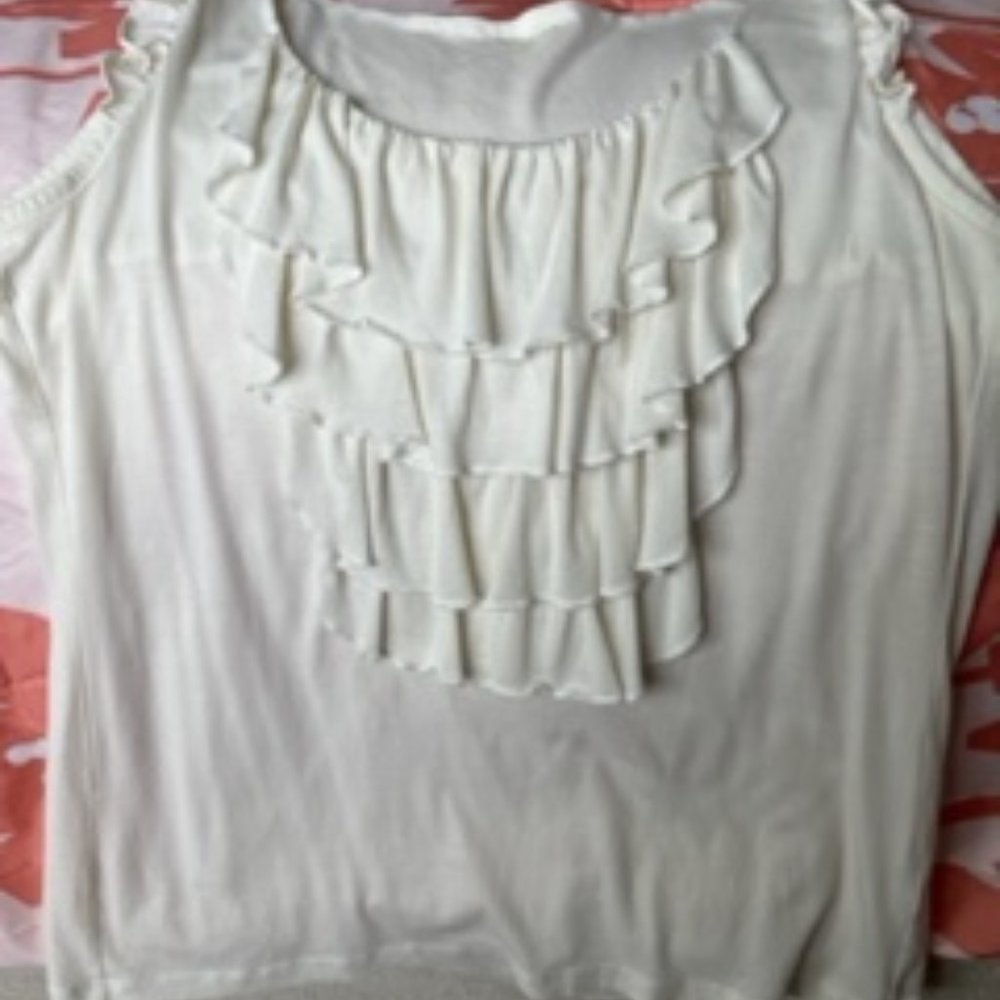 White summer sleeveless top with ruffled front.